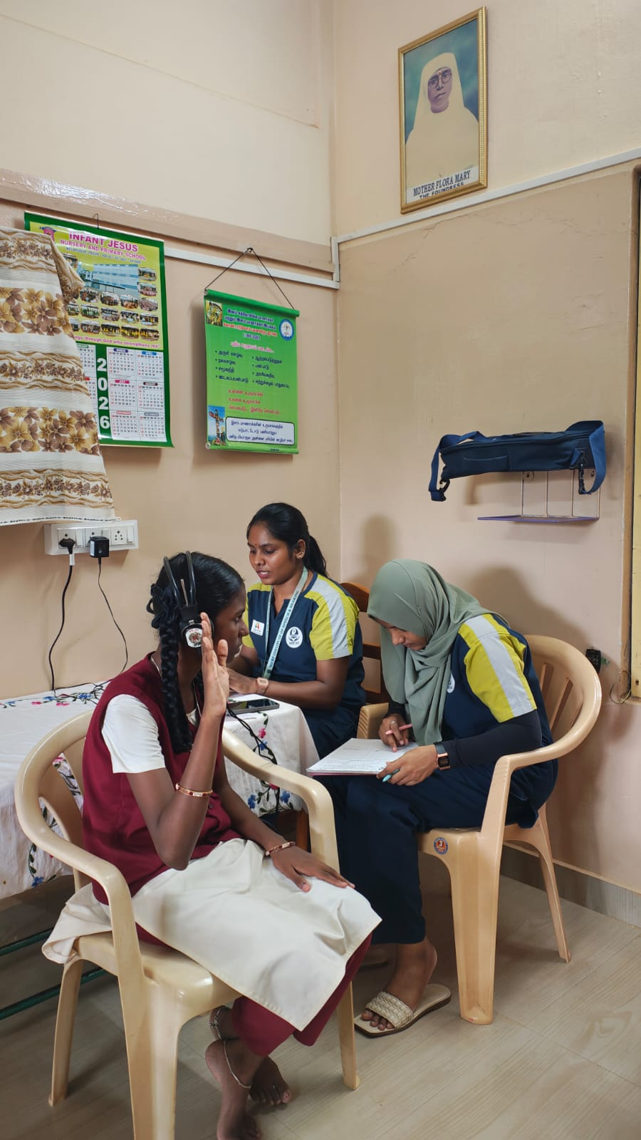 MERF-ISH audiologist conducting hearing test for a student